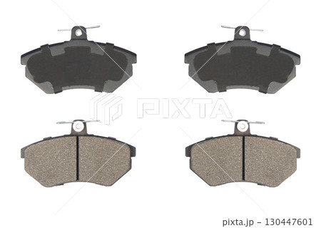 Auto brake pads isolated on white background. Set of brake pads. New auto spare parts isolated on white background 130447601