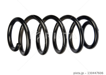 Car spare part. Large metal spring on white background. cushioning spring over white background, auto spare parts. automotive suspension springs on a white background 130447606