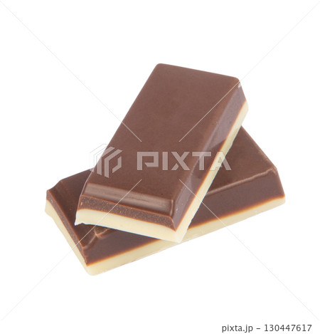 Chocolate pieces on a white background Chocolate pieces on a white background 130447617