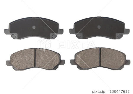 Auto brake pads isolated on white background. Set of brake pads. New auto spare parts isolated on white background Auto brake pads isolated on white background. Set of brake pads. New auto spare parts isolated on white background 130447632