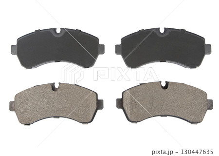 Auto brake pads isolated on white background. Set of brake pads. New auto spare parts isolated on white background 130447635