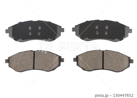 Auto brake pads isolated on white background. Set of brake pads. New auto spare parts isolated on white background Auto brake pads isolated on white background. Set of brake pads. New auto spare parts isolated on white background 130447652