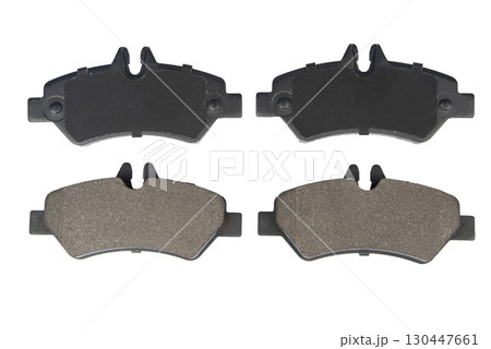 Auto brake pads isolated on white background. Set of brake pads. New auto spare parts isolated on white background 130447661