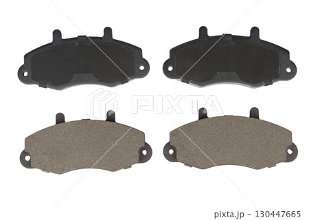 Auto brake pads isolated on white background. Set of brake pads. New auto spare parts isolated on white background 130447665