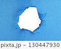 Hole in paper color background damaged ripped 130447930