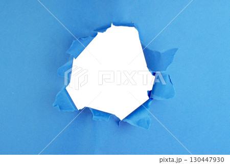 Hole in paper color background damaged ripped 130447930