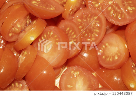 Close up of lots of chopped baby cherry tomatoes for background Close up of lots of chopped baby cherry tomatoes for background 130448087