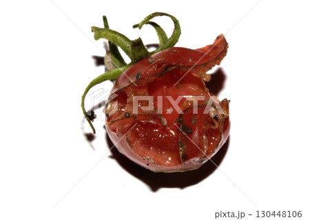 Very mouldy and squashed tomato spoiled and decomposing on white background 130448106