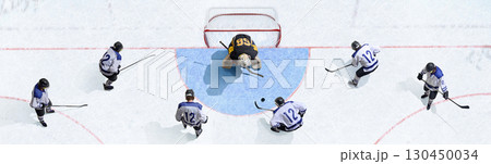 Creative collage. Aerial perspective hockey goalkeeper facing multiple attackers in tense play. Banner Creative collage. Aerial perspective hockey goalkeeper facing multiple attackers in tense play. Banner 130450034