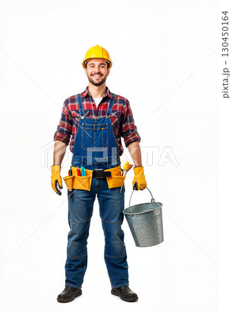 Cheerful construction worker smiling while holding a bucket, teamwork spirit 130450164