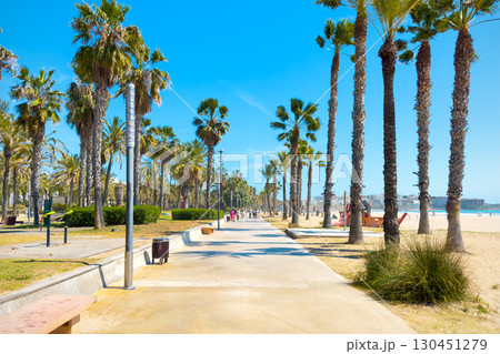 Maritime walk with palm trees in Salou, famous touristic destination, Catalonia, Spain. Maritime walk with palm trees in Salou, famous touristic destination, Catalonia, Spain. 130451279