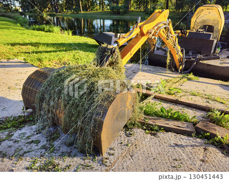 excavator's bucket was covered in algae 130451443