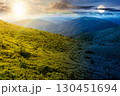 mountain landscape in summer. day and night time change concept. beautiful view of rolling green hills and alpine meadows with sun and moon. scenery with clouds on sky. scenic nature background 130451694