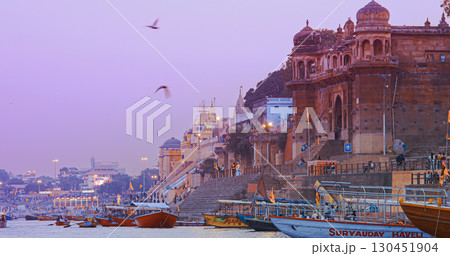 Varanasi, India. Hundreds Of Tourists And Locals Gather On Boats To Watch Fire Ceremony Or Puja At Assi Ghat. Ganga Maha Aarti Ceremony. Traditional Ganga Aarti In Varanasi. Cinematic Camera Movement Varanasi, India. Hundreds Of Tourists And Locals Gather On Boats To Watch Fire Ceremony Or Puja At Assi Ghat. Ganga Maha Aarti Ceremony. Traditional Ganga Aarti In Varanasi. Cinematic Camera Movement 130451904