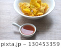 crispy fried dumpling paste stuffed chop pork and shrimp dipping sweet chili sauce on bowl 130453359