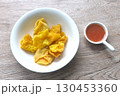 crispy fried dumpling paste stuffed chop pork and shrimp dipping sweet chili sauce on bowl 130453360