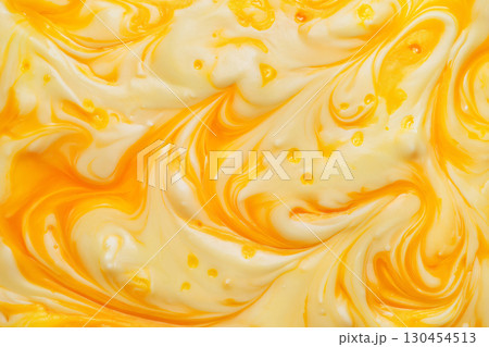 Abstract background of yellow and white paint mixing together and creating a marble effect 130454513