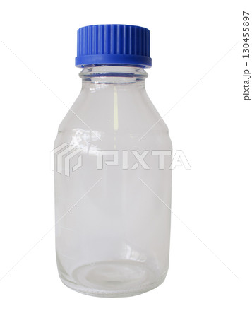 Clear glass laboratory bottle with blue plastic screw cap, used for storing chemicals and solutions. 130455897