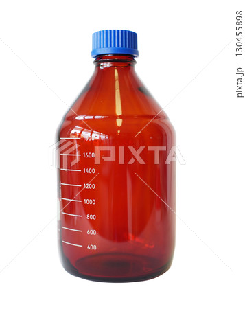 Amber glass laboratory bottle with blue plastic screw cap and volume scale, used for storing light-sensitive chemicals. Amber glass laboratory bottle with blue plastic screw cap and volume scale, used for storing light-sensitive chemicals. 130455898