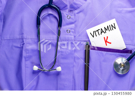 Vitamin K phylloquinone symbol. Concept words Vitamin K on beautiful white card. Stethoscope and pen. Beautiful medical uniform. Medical healthy lifestyle Vitamin K phylloquinone concept. Vitamin K phylloquinone symbol. Concept words Vitamin K on beautiful white card. Stethoscope and pen. Beautiful medical uniform. Medical healthy lifestyle Vitamin K phylloquinone concept. 130455980