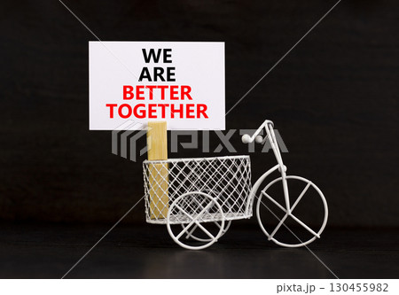 We are better together symbol. Concept words phrase We are better together on beautiful white paper on clothespin. Beautiful black background. Business We are better together concept. Copy space. We are better together symbol. Concept words phrase We are better together on beautiful white paper on clothespin. Beautiful black background. Business We are better together concept. Copy space. 130455982