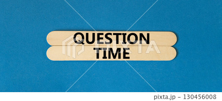 Question time symbol. Concept words Question time on beautiful wooden sticks. Beautiful blue background. Business and question time concept. Copy space. Question time symbol. Concept words Question time on beautiful wooden sticks. Beautiful blue background. Business and question time concept. Copy space. 130456008