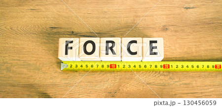 Force symbol. Concept word Force on beautiful wooden blocks. Beautiful wooden table wooden background. Beautiful yellow ruler. Business lifestyle force concept. Copy space. Force symbol. Concept word Force on beautiful wooden blocks. Beautiful wooden table wooden background. Beautiful yellow ruler. Business lifestyle force concept. Copy space. 130456059