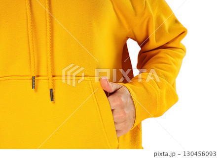 Person in a bright yellow hoodie, on white background 130456093