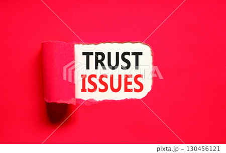 Trust issues symbol. Concept word Trust issues on beautiful white paper. Beautiful red paper background. Business trust issues concept. Copy space. Trust issues symbol. Concept word Trust issues on beautiful white paper. Beautiful red paper background. Business trust issues concept. Copy space. 130456121