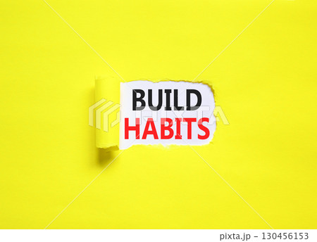 Build habits symbol. Concept word Build habits on beautiful white paper. Beautiful yellow paper background. Business build habits concept. Copy space. 130456153