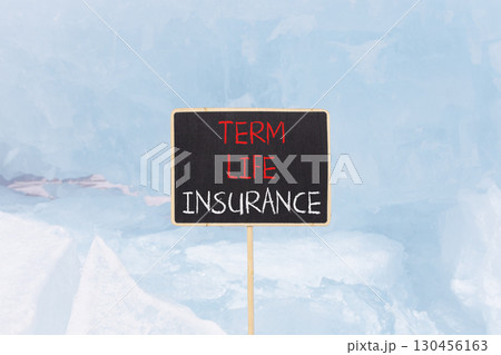 Term life insurance symbol. Concept words Term life insurance on beautiful black yellow blackboard. Beautiful blue Baikal ice background. Business term life insurance concept. Copy space. Term life insurance symbol. Concept words Term life insurance on beautiful black yellow blackboard. Beautiful blue Baikal ice background. Business term life insurance concept. Copy space. 130456163
