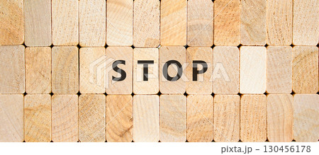 Stop symbol. Concept word Stop on beautiful wooden blocks. Beautiful wooden blocks background. Business, lifestyle, support and stop concept. Copy space. Stop symbol. Concept word Stop on beautiful wooden blocks. Beautiful wooden blocks background. Business, lifestyle, support and stop concept. Copy space. 130456178