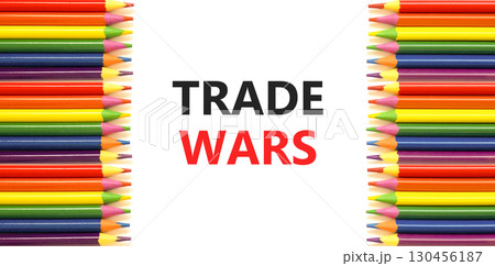 Trade wars symbol. Concept word Trade wars on beautiful white paper. Colored pencils. Beautiful white paper background. Business trade wars concept. Copy space. Trade wars symbol. Concept word Trade wars on beautiful white paper. Colored pencils. Beautiful white paper background. Business trade wars concept. Copy space. 130456187