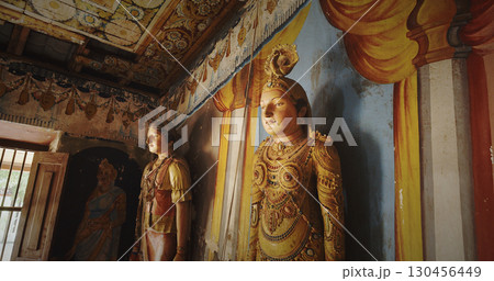 Elegant Statues Surrounded by Stunning Temple Mural Works 130456449