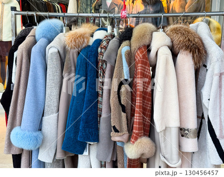 Fur coats hanging on rack in boutique. Fashion apparel, winter clothing and luxury textile for retail shopping, style trend and seasonal wardrobe collection. Fur coats hanging on rack in boutique. Fashion apparel, winter clothing and luxury textile for retail shopping, style trend and seasonal wardrobe collection. 130456457