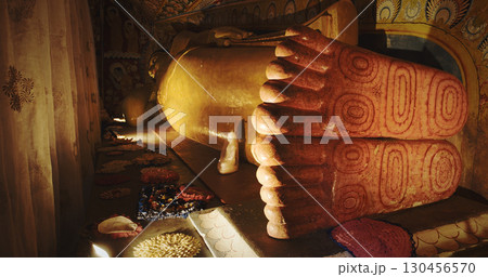 Reclining Buddha with Beautifully Carved Feet on Display 130456570