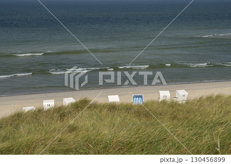Sylt Island Sunbeds Strandkorbe Outsun on the sandy beach 130456899