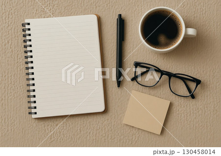 Cozy Coffee Desk Scene with Notebook and Glasses 130458014