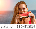 Watermelon Woman Beach Summer: Happy woman enjoys juicy watermelon slice seaside, sunny day, healthy snack. 130458919