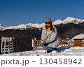 Snow Mountains Woman Winter: Caucasian Woman plays with snow in snowy mountains resort during winter. 130458942