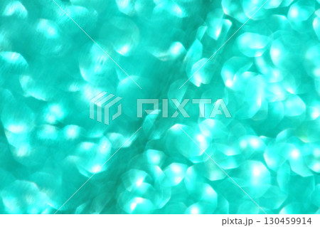 Abstract turquoise bokeh lights pattern with soft circular shapes on blurred Abstract turquoise bokeh lights pattern with soft circular shapes on blurred 130459914