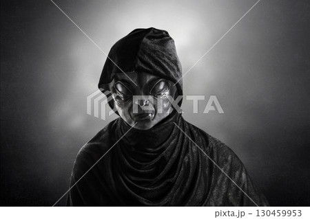 Mysterious humanoid alien at night over dark misty background 130459953
