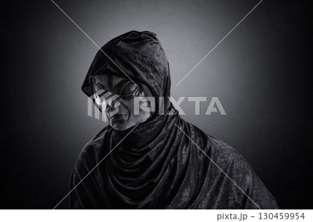 Mysterious humanoid alien at night over dark misty background 130459954