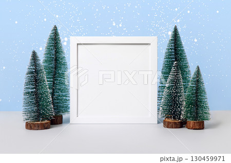 Christmas background with Christmas trees and white frame for text, greetings, promotions, and discounts. Christmas and New Year card. 130459971