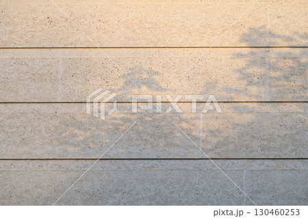 Wall with texture and shadows. Grey concrete background 130460253