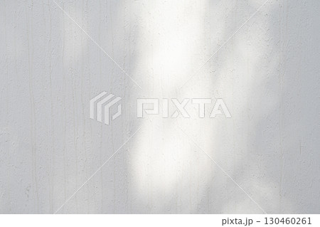 Wall with texture and shadows. Grey concrete background 130460261