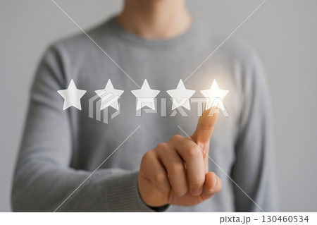 User Feedback Evaluation Customer Selecting Fifth Star on Transparent Rating Scale in a Minimal Grey Background User Feedback Evaluation Customer Selecting Fifth Star on Transparent Rating Scale in a Minimal Grey Background 130460534