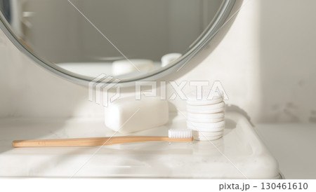 Minimalist bathroom counter with bamboo toothbrush and eco-friendly morning essentials 130461610