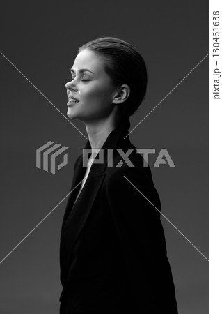 Black and white portrait of a calm woman in a blazer with closed eyes and serene expression Black and white portrait of a calm woman in a blazer with closed eyes and serene expression 130461638
