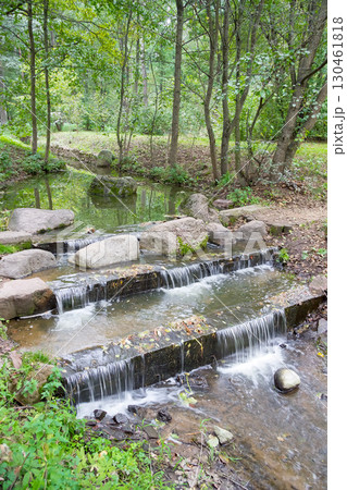 landscape with fast forest stream with stones in summer 130461818